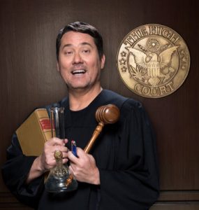 Doug Benson holding a book, a cannabis bong and a gavel. cannabis TV